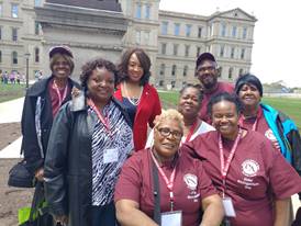 A group of Detroit Area Agency on Aging volunteers outside at an event.