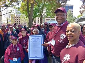 A group of Detroit Area Agency on Aging volunteers outside at an event.